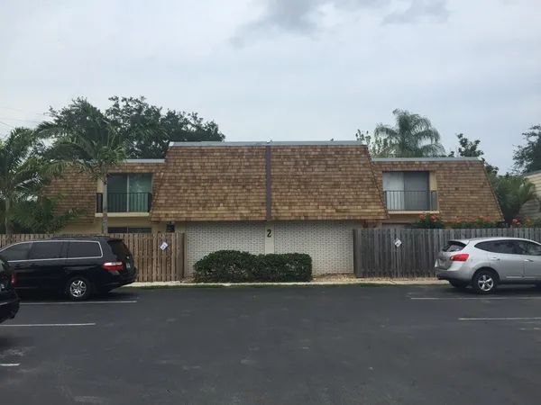 a car parked in front of a house