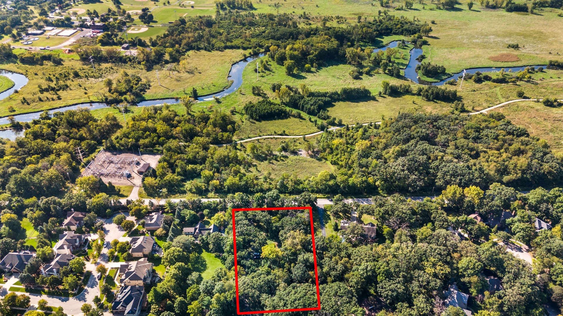 25-w 500 Royce Road Naperville, IL 60565 - Photo 2 of 15 an aerial view of residential house with outdoor space and trees all around