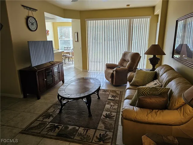 a view of a kitchen with furniture and a window
