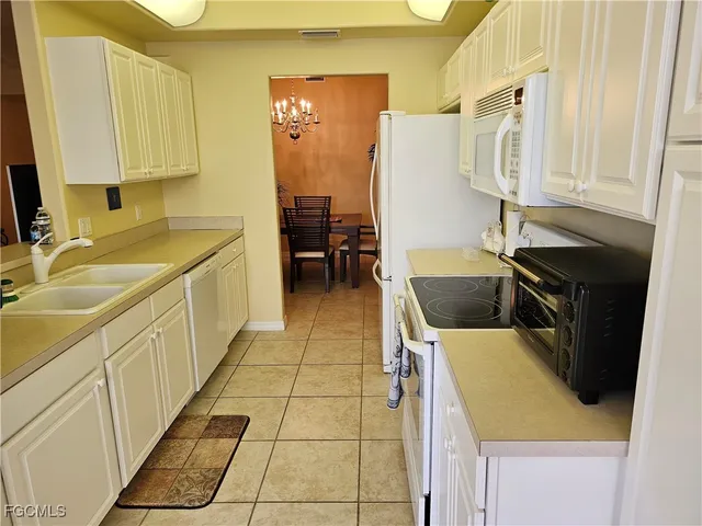a living room with furniture and a mirror