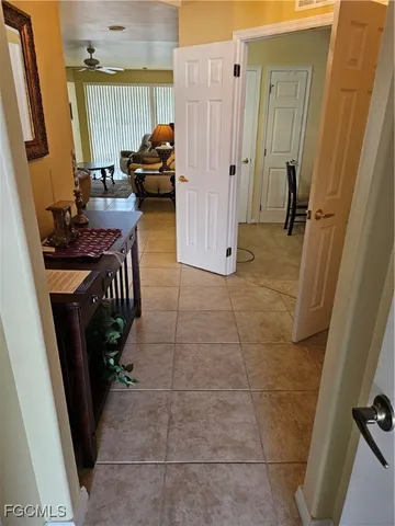 a view of hallway with furniture and a gate
