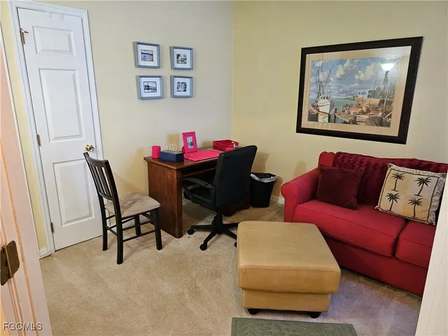 a living room with furniture and a chair