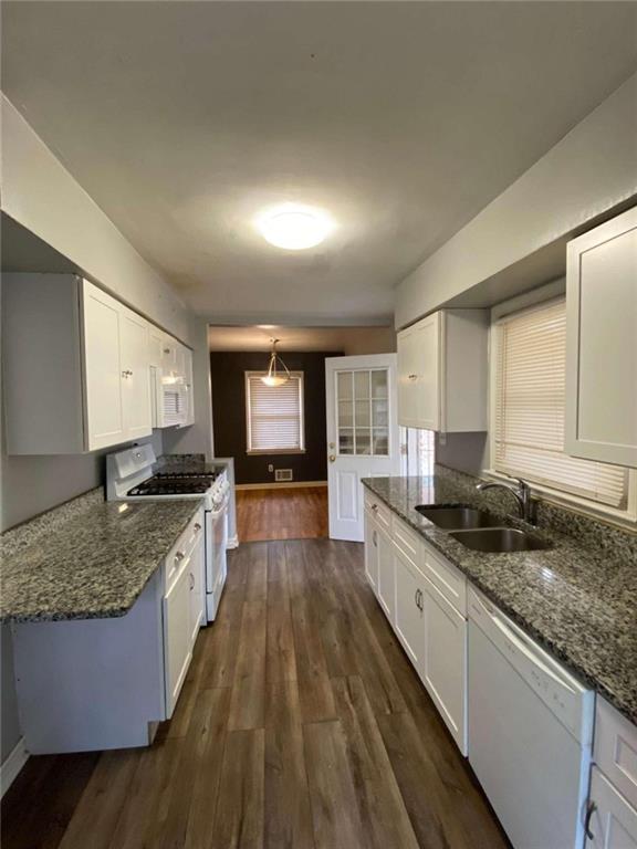 1748 Meadowglades Drive Decatur, GA 30035 - Photo 1 of 1 a large kitchen with a granite countertop counter space a sink and stainless steel appliances