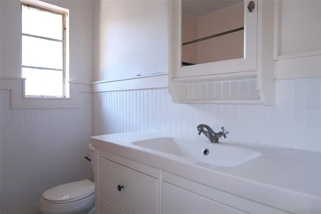 a bathroom with a sink and a toilet