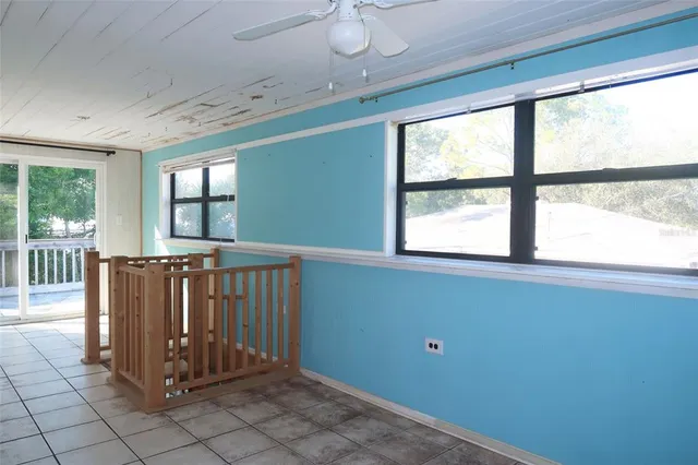 a view of a hallway with windows