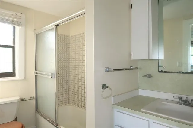 a bathroom with a sink and a shower