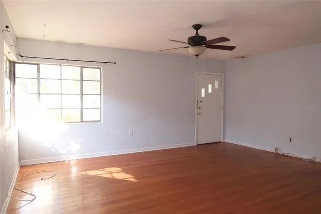 a view of an empty room with a window