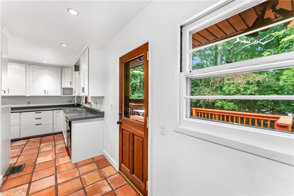 1469 Clairmont Road Decatur, GA 30033 - Photo 12 of 24 a kitchen with stainless steel appliances granite countertop a refrigerator and a sink