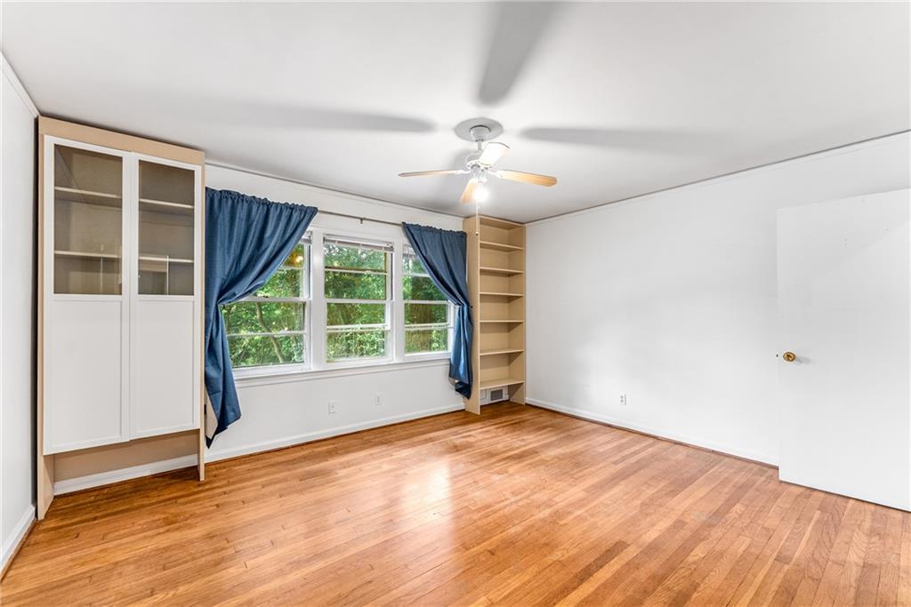 1469 Clairmont Road Decatur, GA 30033 - Photo 14 of 24 an empty room with wooden floor and windows