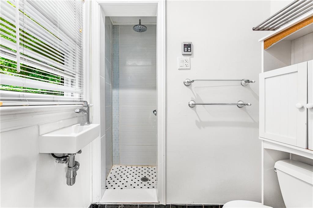 1469 Clairmont Road Decatur, GA 30033 - Photo 15 of 24 a bathroom with a shower a toilet and a sink