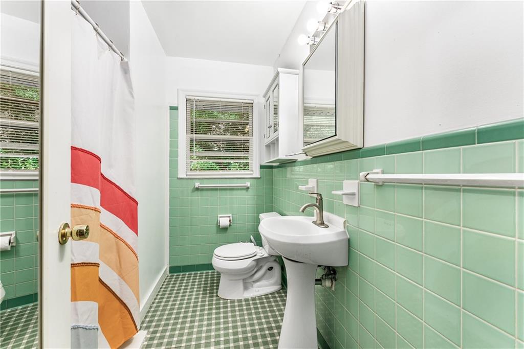 1469 Clairmont Road Decatur, GA 30033 - Photo 16 of 24 a bathroom with a sink toilet and window
