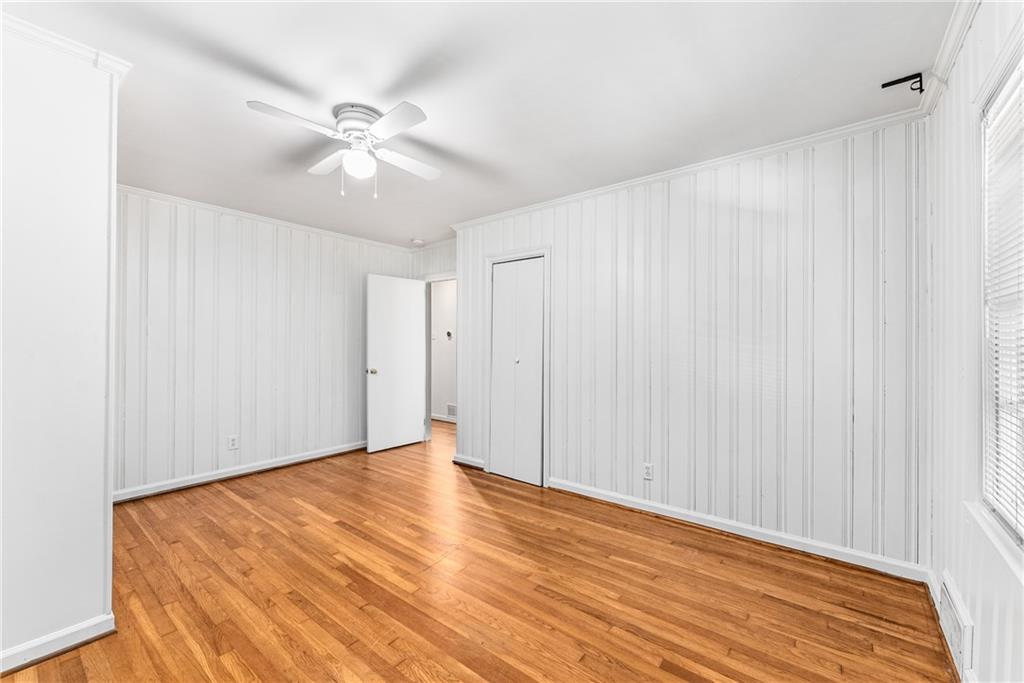 1469 Clairmont Road Decatur, GA 30033 - Photo 20 of 24 a view of an empty room with wooden floor