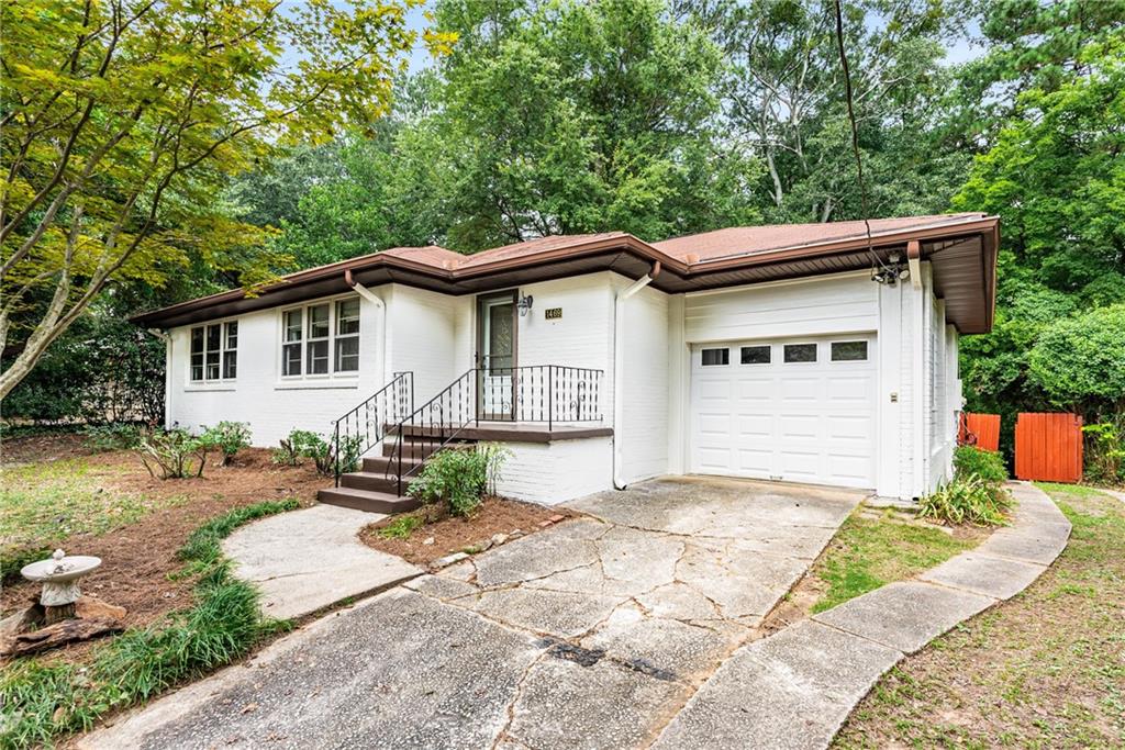 1469 Clairmont Road Decatur, GA 30033 - Photo 2 of 24 a front view of a house with a yard outdoor seating and yard