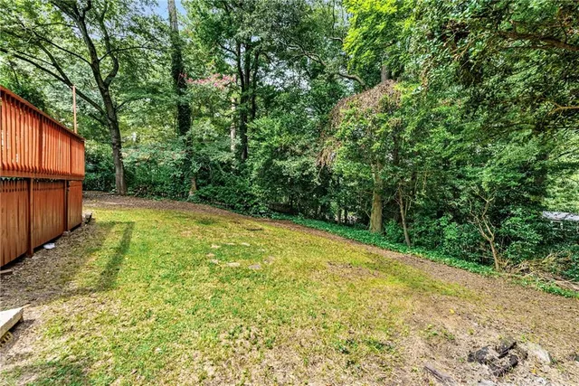 a view of a yard with trees