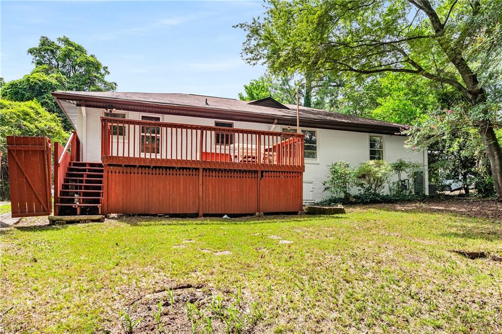 1469 Clairmont Road Decatur, GA 30033 - Photo 22 of 24 a view of a house with backyard and a tree