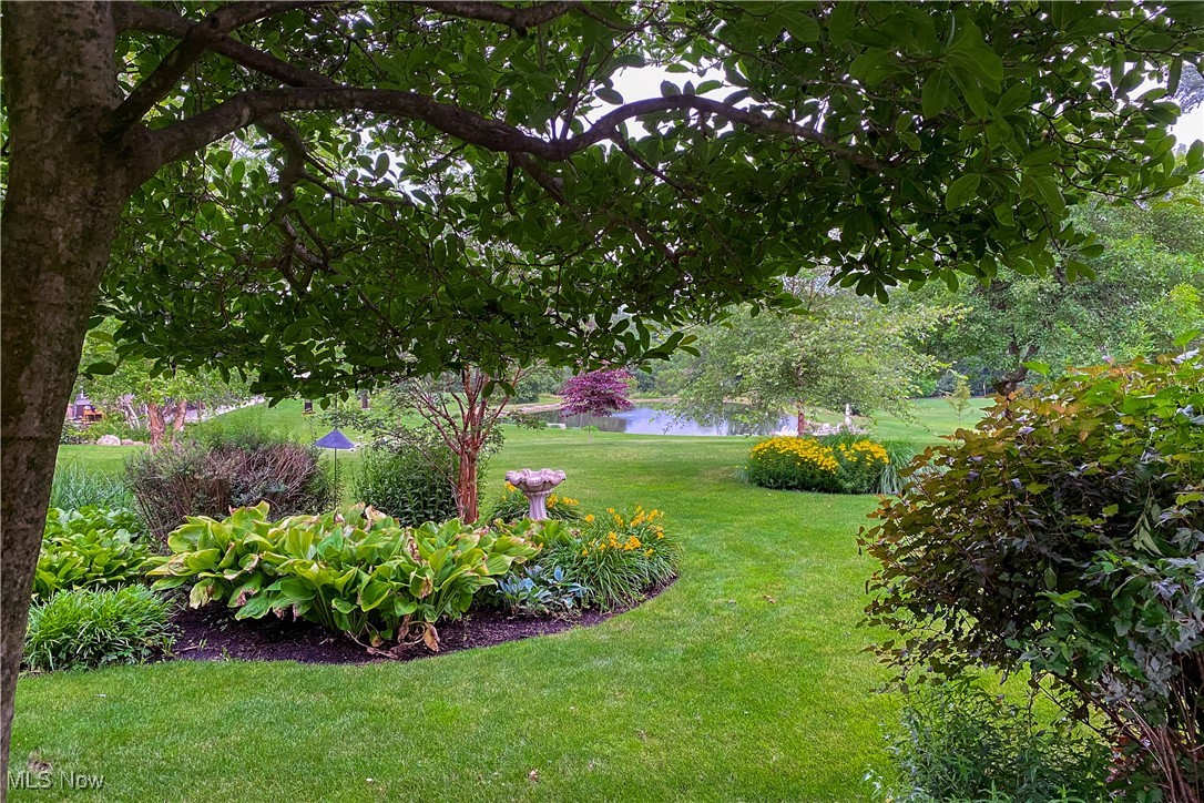8405 Dines Road Novelty, OH 44072 - Photo 41 of 45 Gardens in backyard leading to stocked lake.