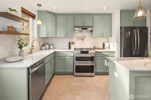 a kitchen with a sink stove and refrigerator