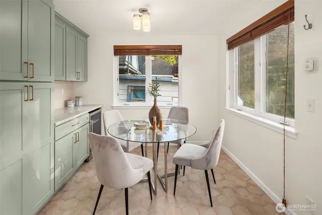 a dining room with furniture and window