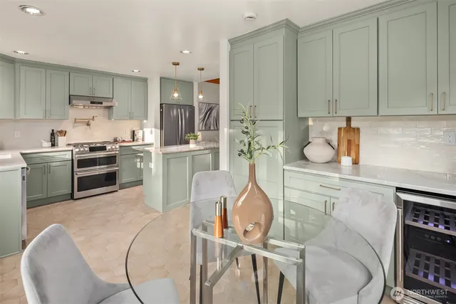 a kitchen with cabinets a sink and appliances