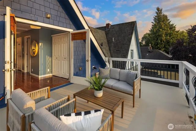 a view of a backyard with couches chair and table