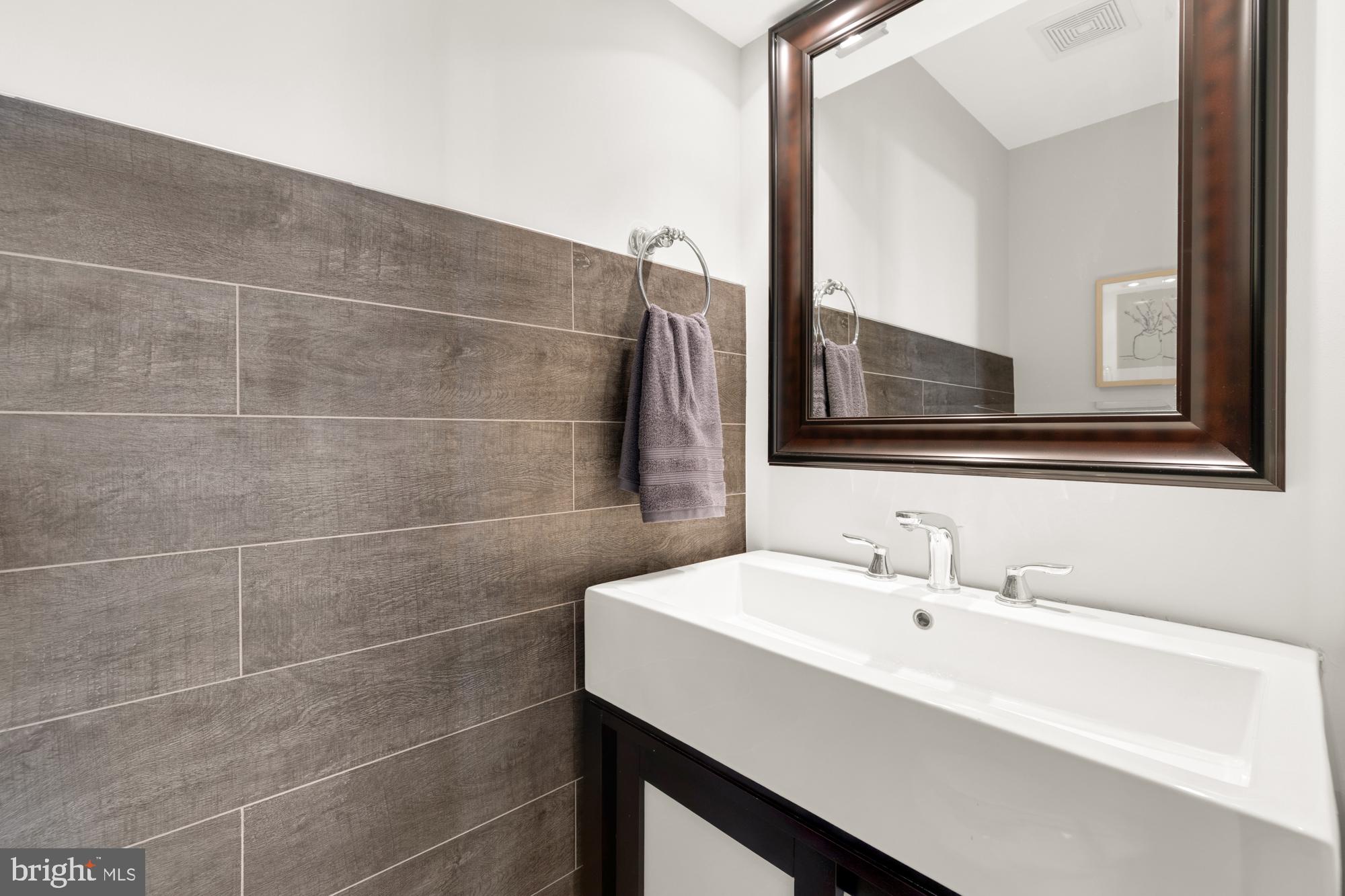 914 Irving Street Northeast Washington, DC 20017 - Photo 22 of 58 First floor half bath