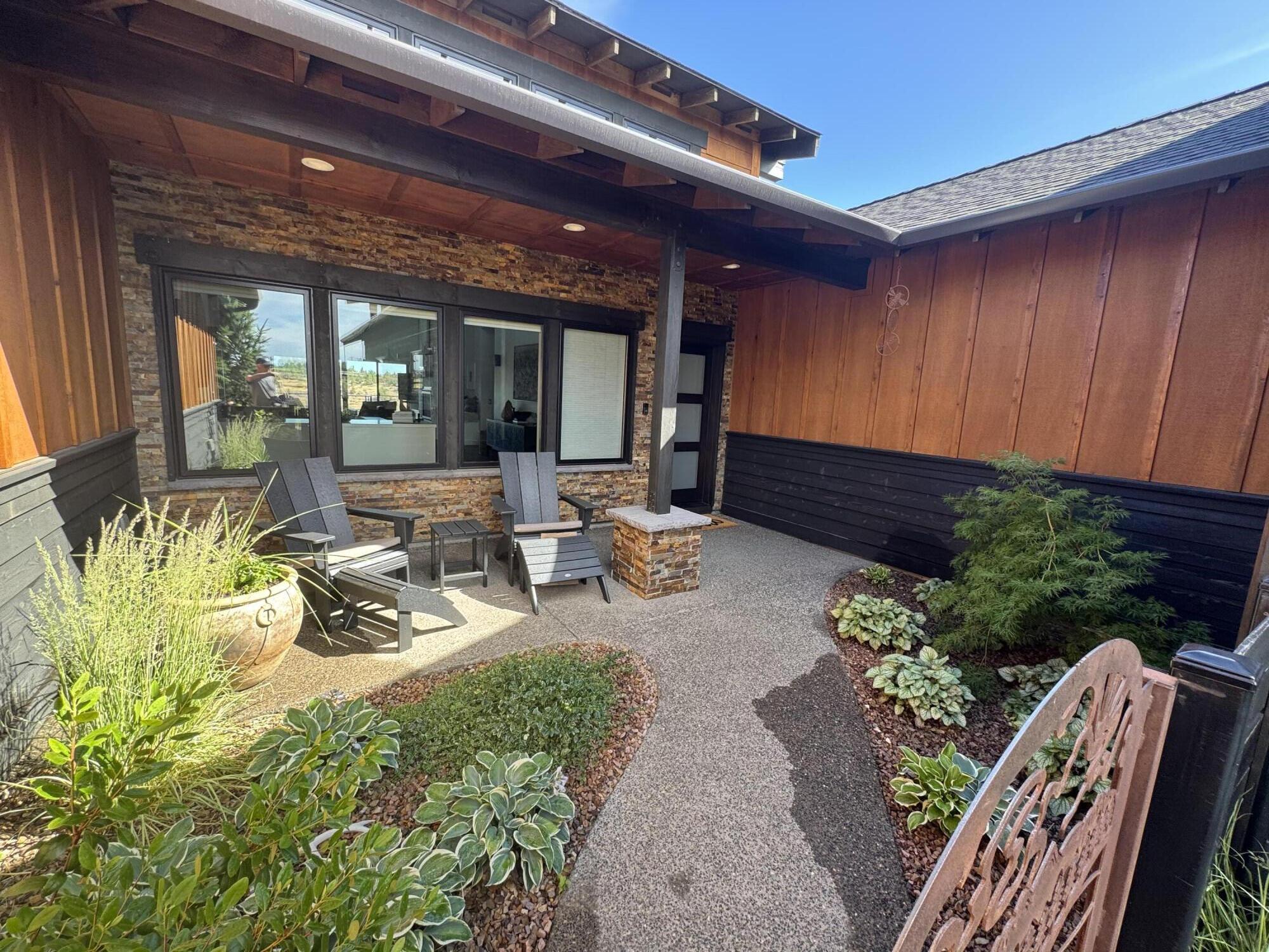 20350 Rock Canyon Road Bend, OR 97703 - Photo 32 of 47 a view of a porch with furniture and garden