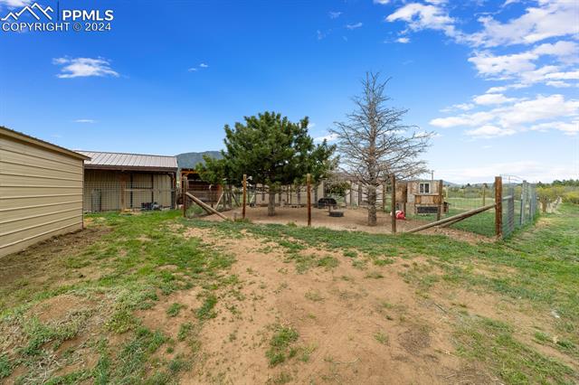 3240 Spaatz Road Monument, CO 80132 - Photo 44 of 45 Large Chicken Coop with chicken pen, Goat Barn and Goat Play area for enrichment and entertainment.