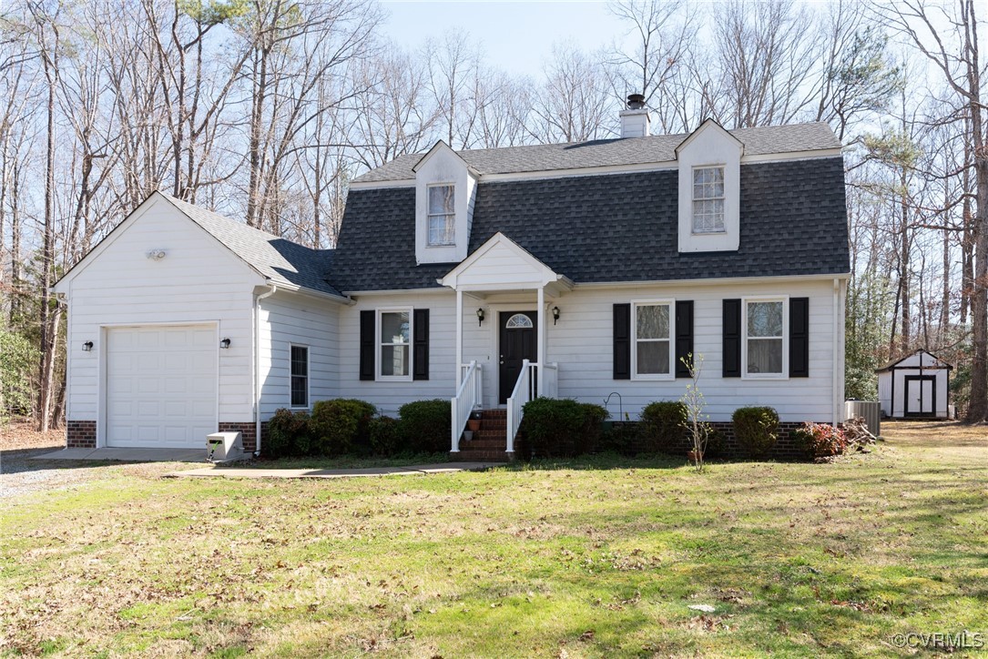 5604 Monguy Road Charles City, VA 23030 - Photo 1 of 49 Colonial inspired home featuring a shingled roof,