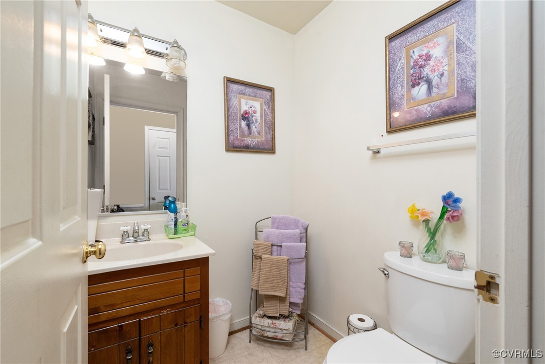 5604 Monguy Road Charles City, VA 23030 - Photo 14 of 49 Bathroom with tile patterned flooring, toilet, van