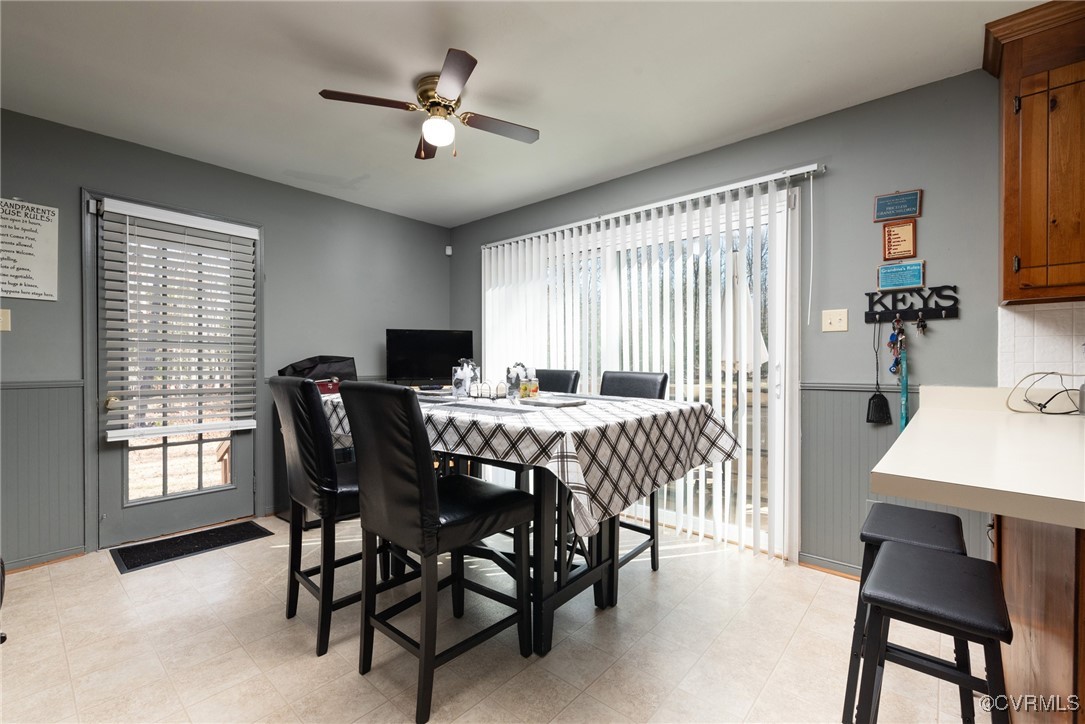 5604 Monguy Road Charles City, VA 23030 - Photo 15 of 49 Dining room with a ceiling fan and wainscoting