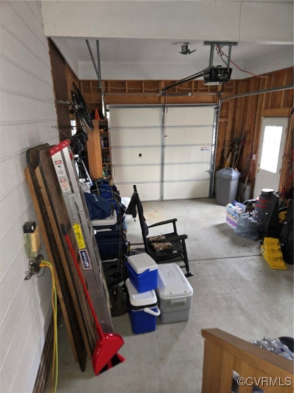 5604 Monguy Road Charles City, VA 23030 - Photo 21 of 49 Garage featuring wooden walls and a garage door op