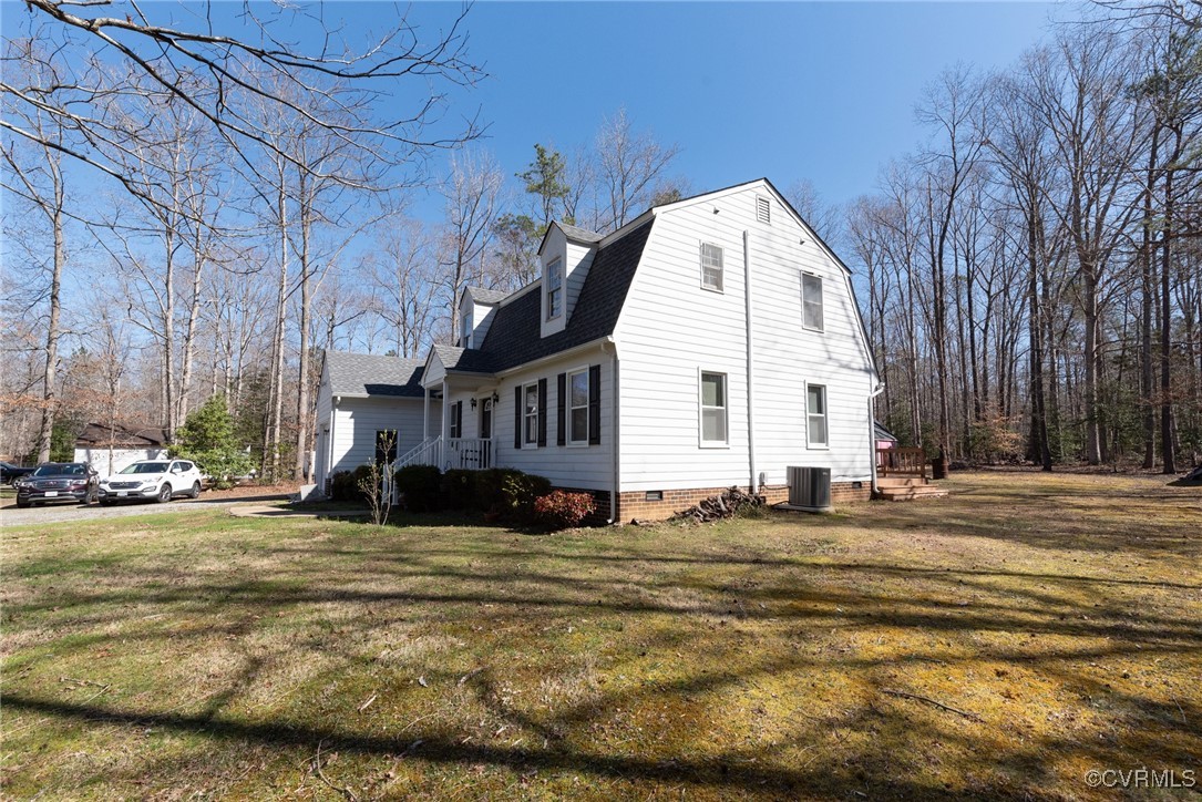 5604 Monguy Road Charles City, VA 23030 - Photo 3 of 49 View of home's exterior with a lawn, central AC, a