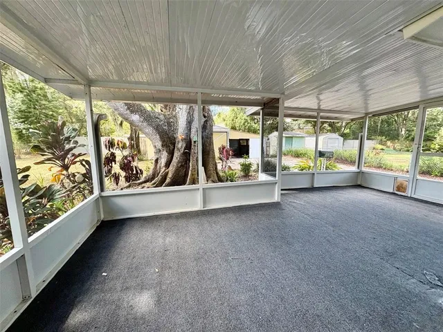 a view of an empty room with a large window
