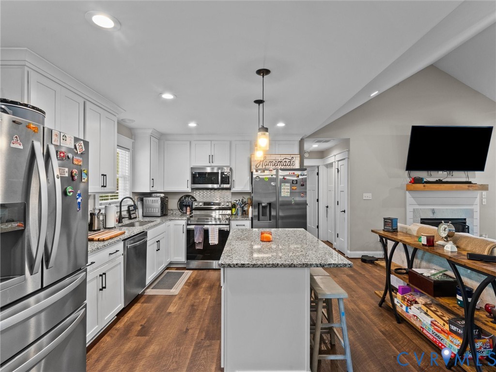 10819 Vaughan Road Petersburg, VA 23805 - Photo 25 of 45 Open-concept kitchen featuring white cabinetry, wo