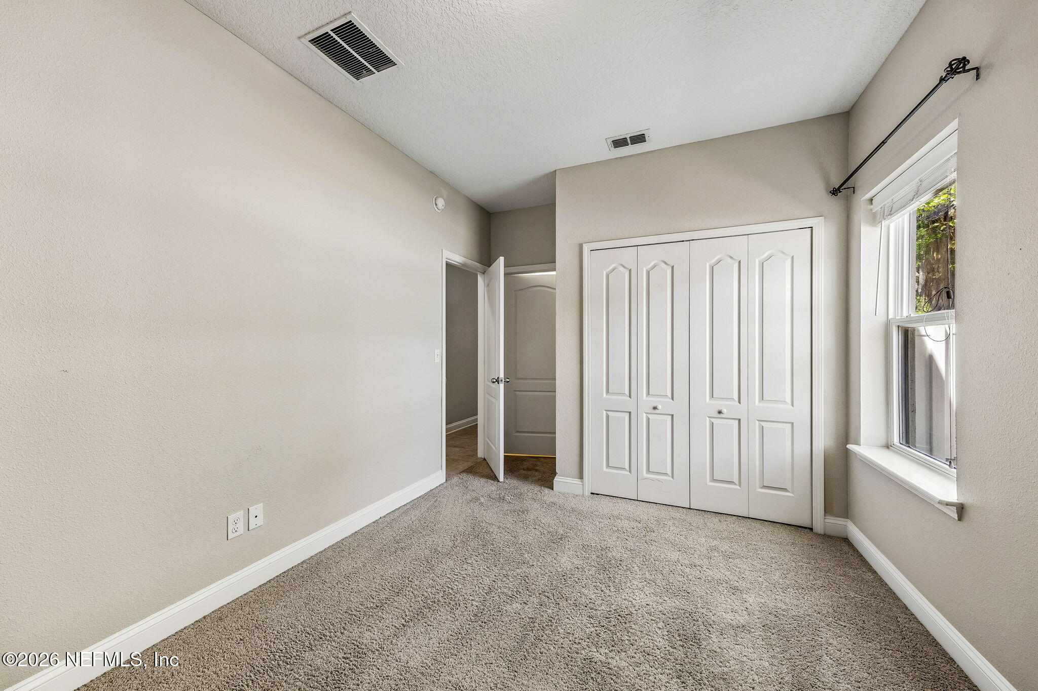 12198 Ridge Crossing Way Jacksonville, FL 32226 - Photo 32 of 67 an empty room with windows