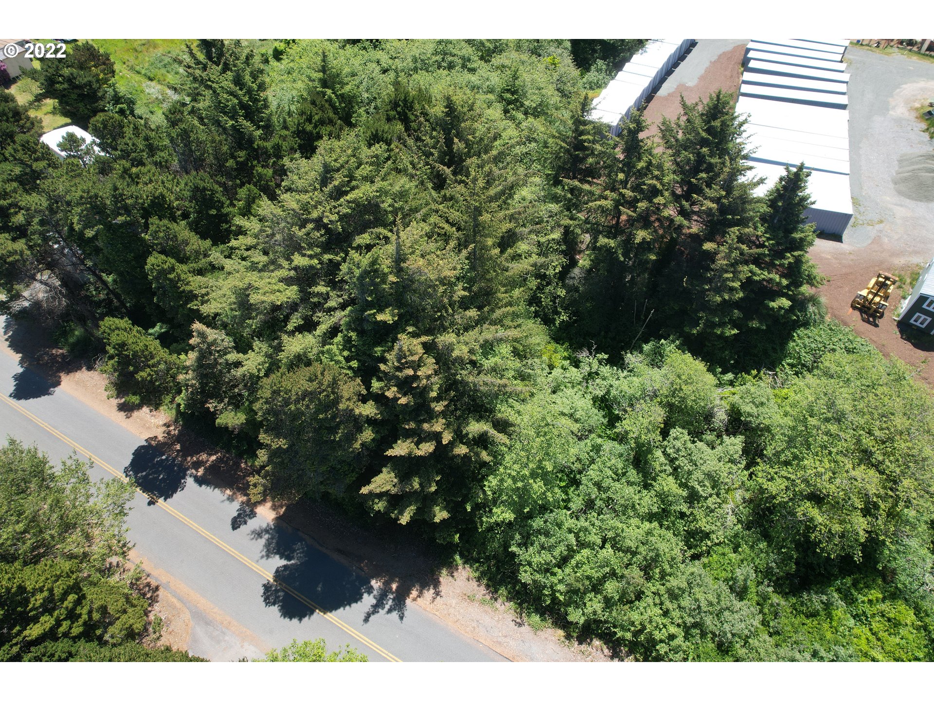 0 Grange Road, Unit 2000 Gold Beach, OR 97444 - Photo 3 of 27 a view of a house with a tree
