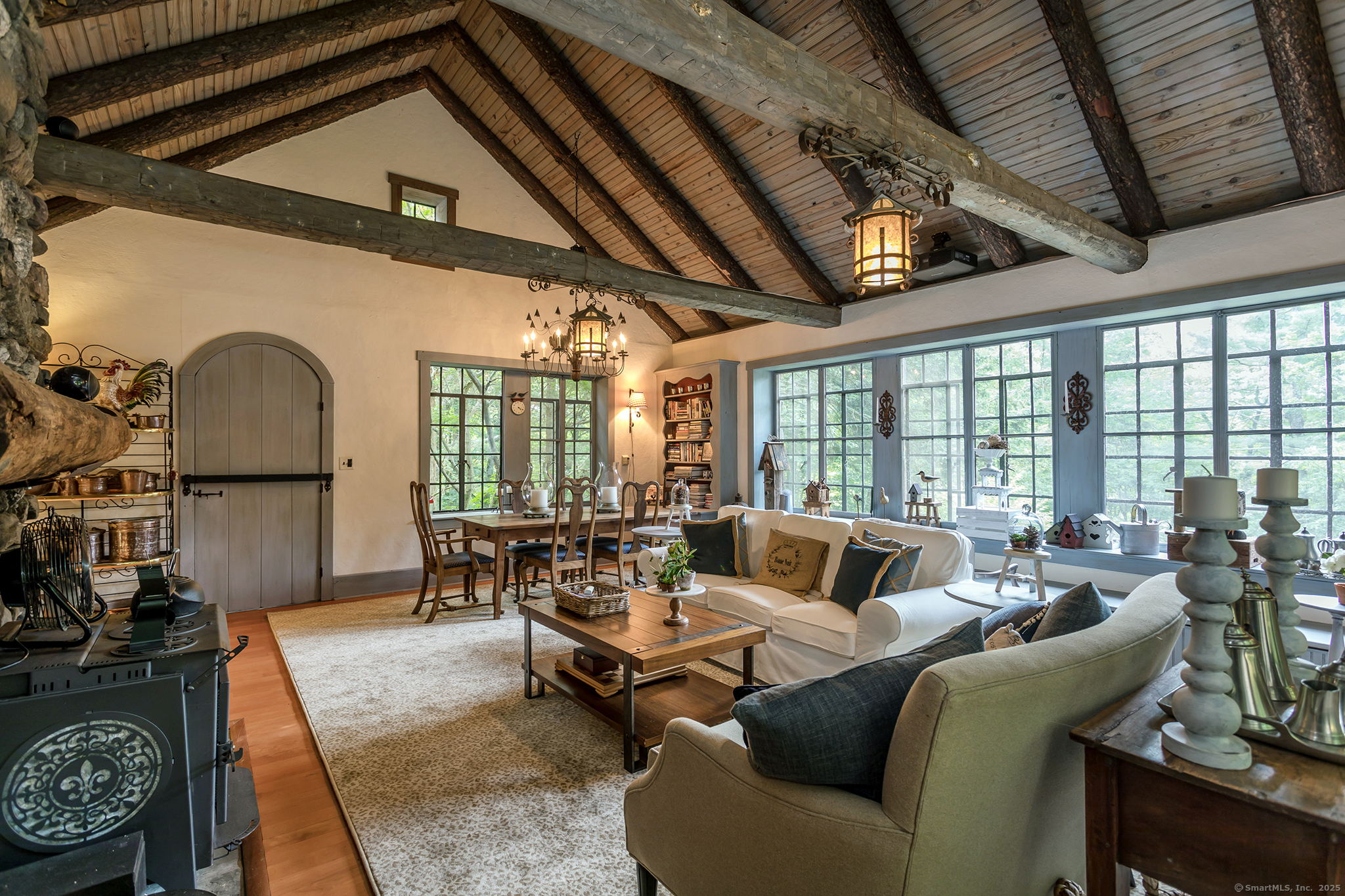 60 Leach Hollow Road Sherman, CT 06784 - Photo 16 of 24 a living room with furniture fireplace and floor to ceiling windows