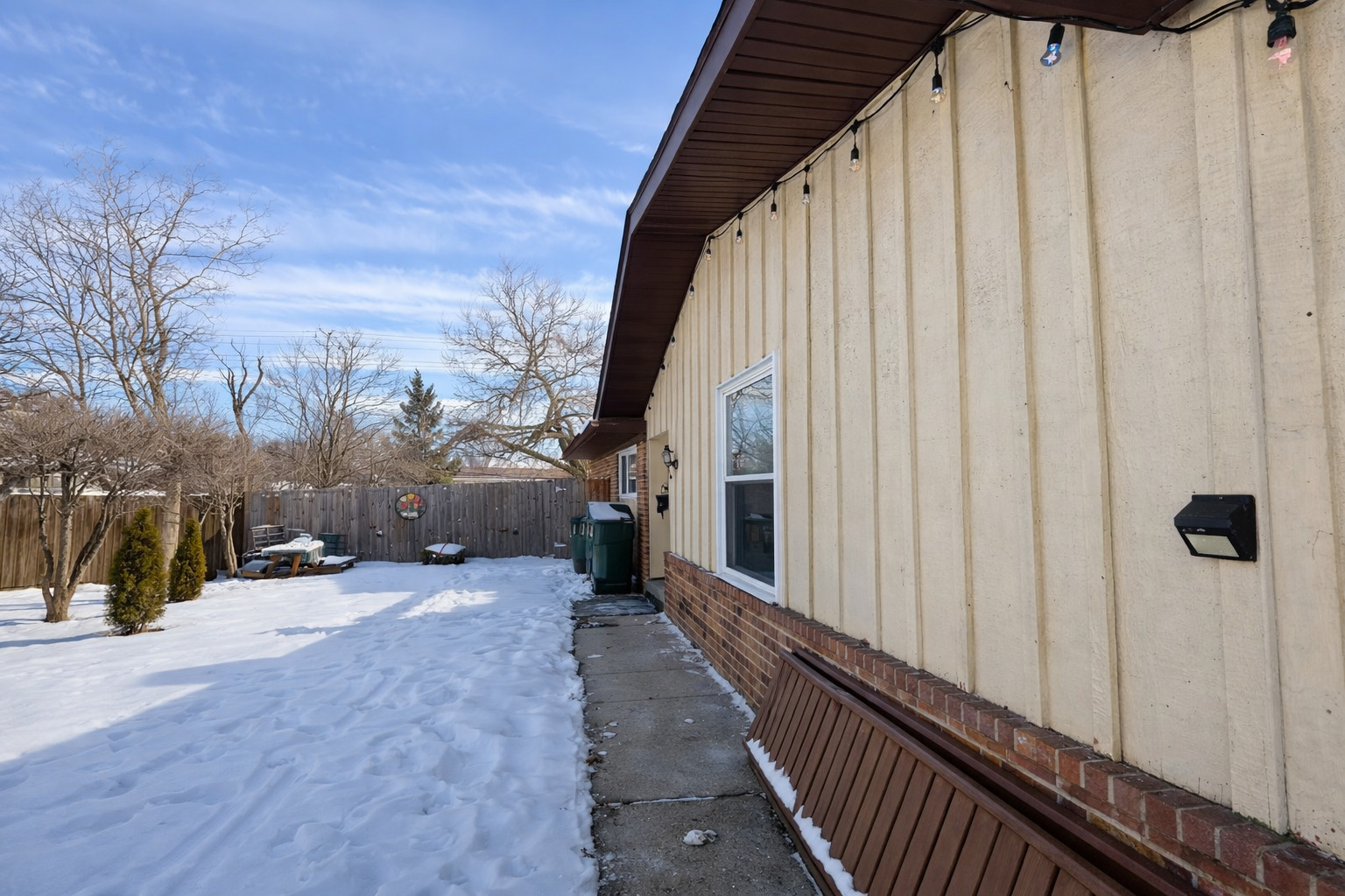 1341 Beverly Lane Streamwood, IL 60107 - Photo 3 of 14 a view of a balcony with chairs and wooden fence