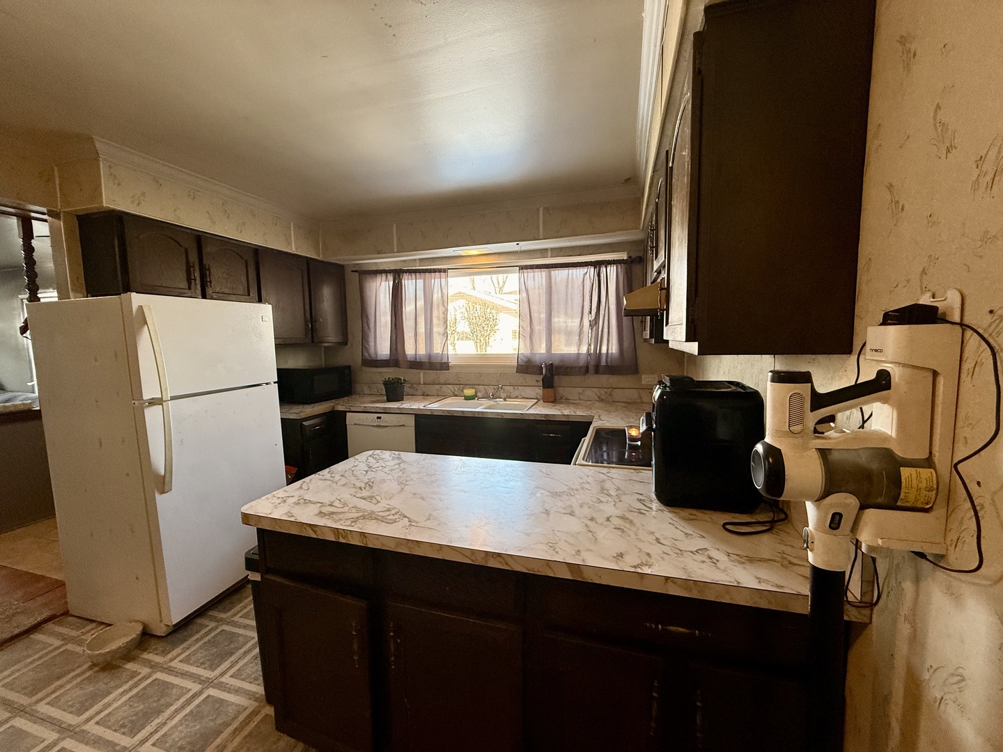 1341 Beverly Lane Streamwood, IL 60107 - Photo 4 of 14 a kitchen with a refrigerator a stove a sink and a dishwasher