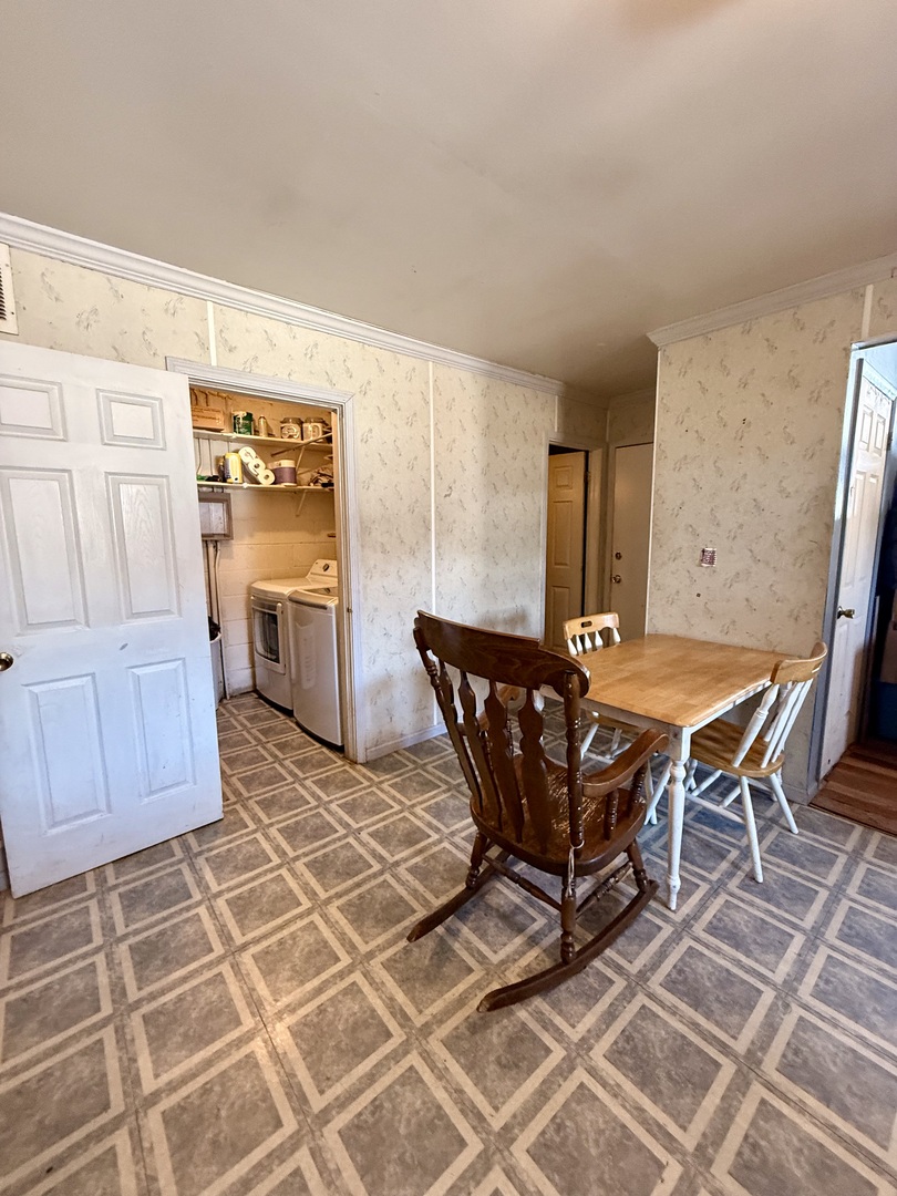 1341 Beverly Lane Streamwood, IL 60107 - Photo 6 of 14 a view of a dining room with furniture and chandelier