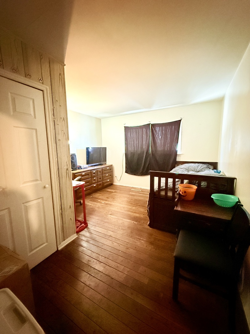 1341 Beverly Lane Streamwood, IL 60107 - Photo 9 of 14 a living room with furniture and a wooden floor