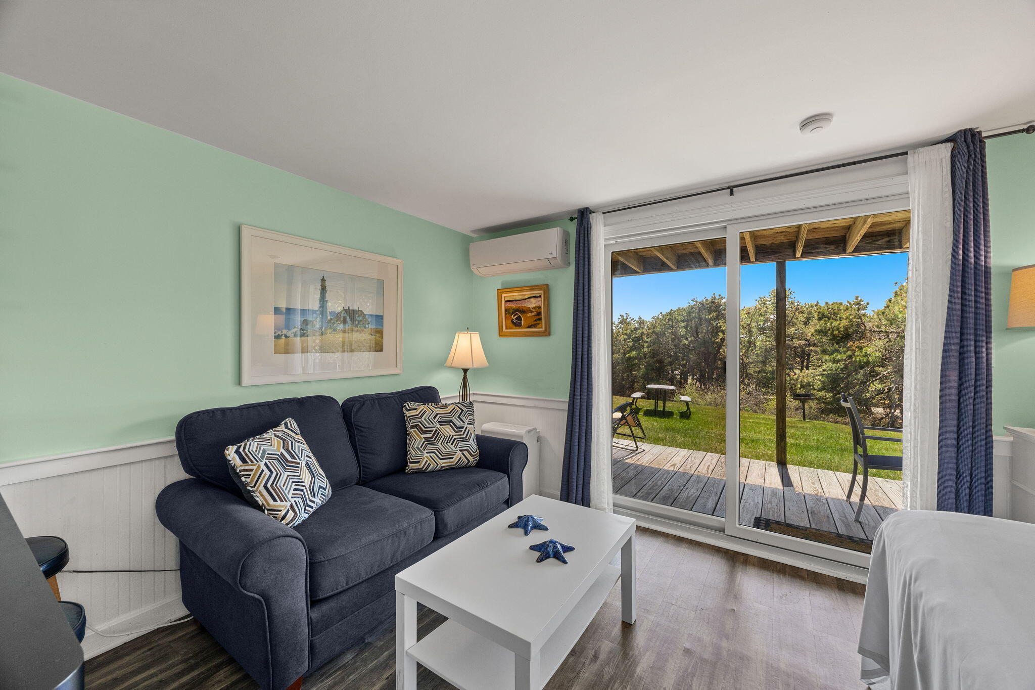 132 Shore Road, Unit 13 Truro, MA 02666 - Photo 5 of 21 a living room with furniture and a large window
