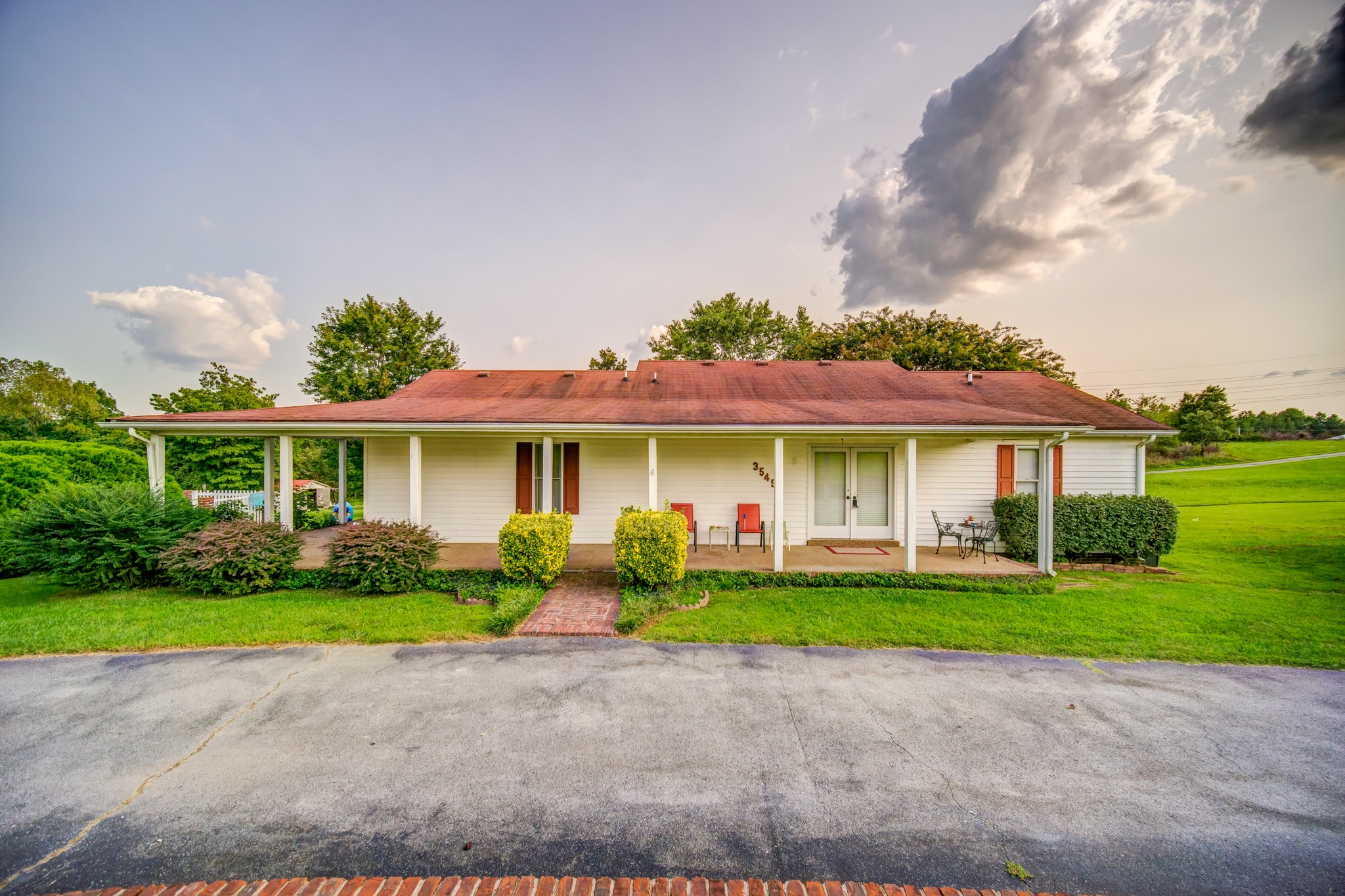 3545 Kelton Jackson Road Springfield, TN 37172 - Photo 1 of 47 a front view of a house with a garden and yard