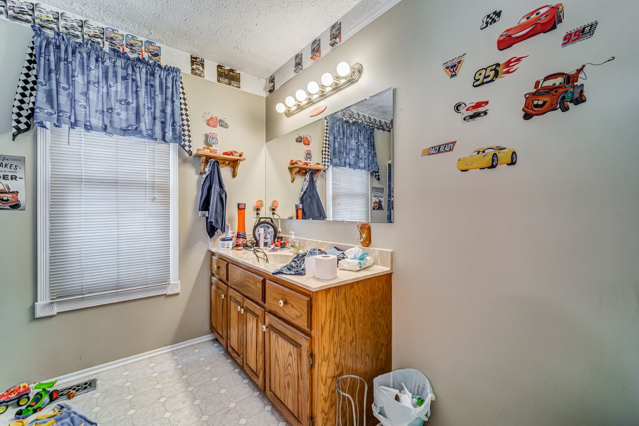 3545 Kelton Jackson Road Springfield, TN 37172 - Photo 35 of 47 a bathroom with a sink mirror and vanity
