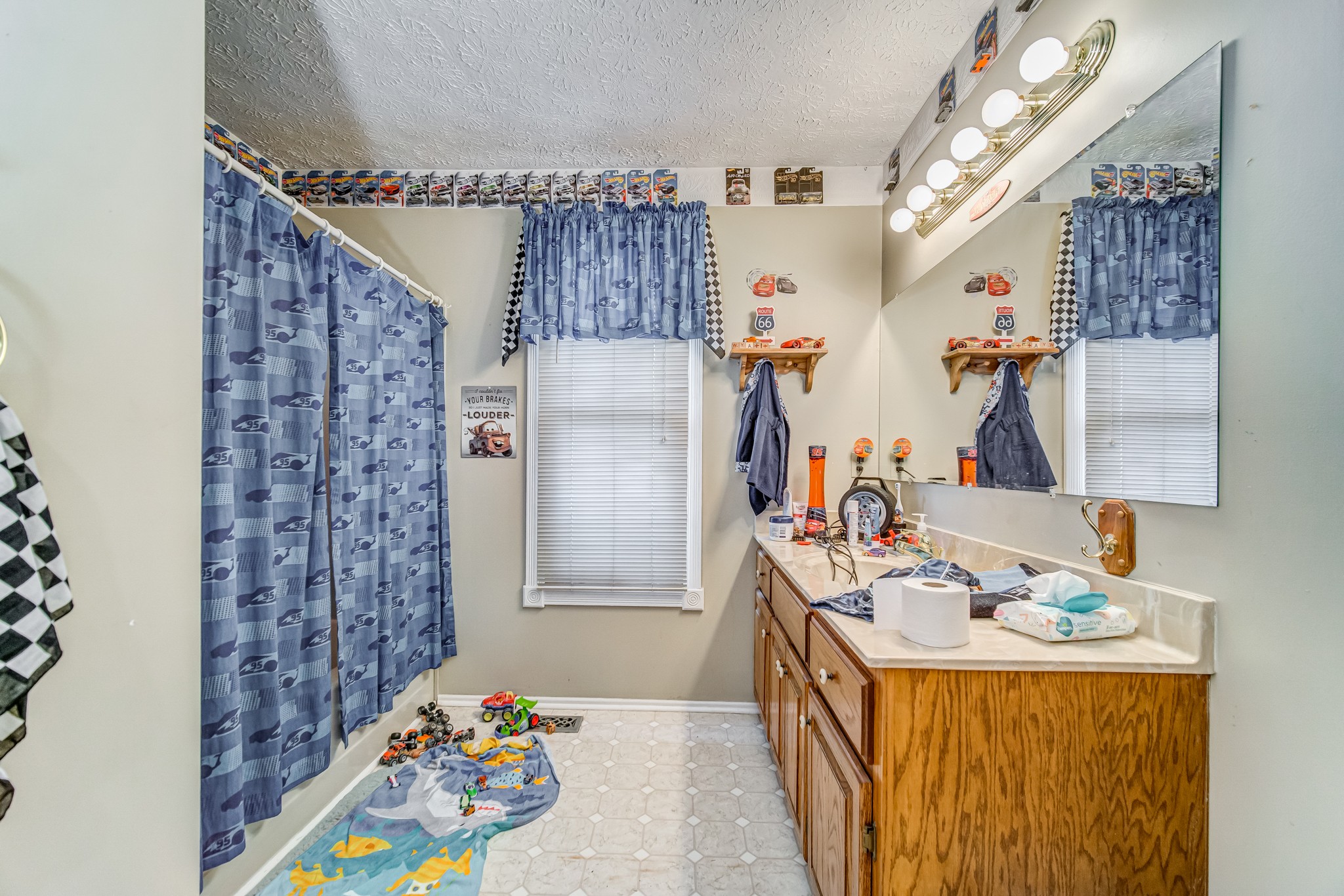 3545 Kelton Jackson Road Springfield, TN 37172 - Photo 36 of 47 a bathroom with a sink mirror and shower