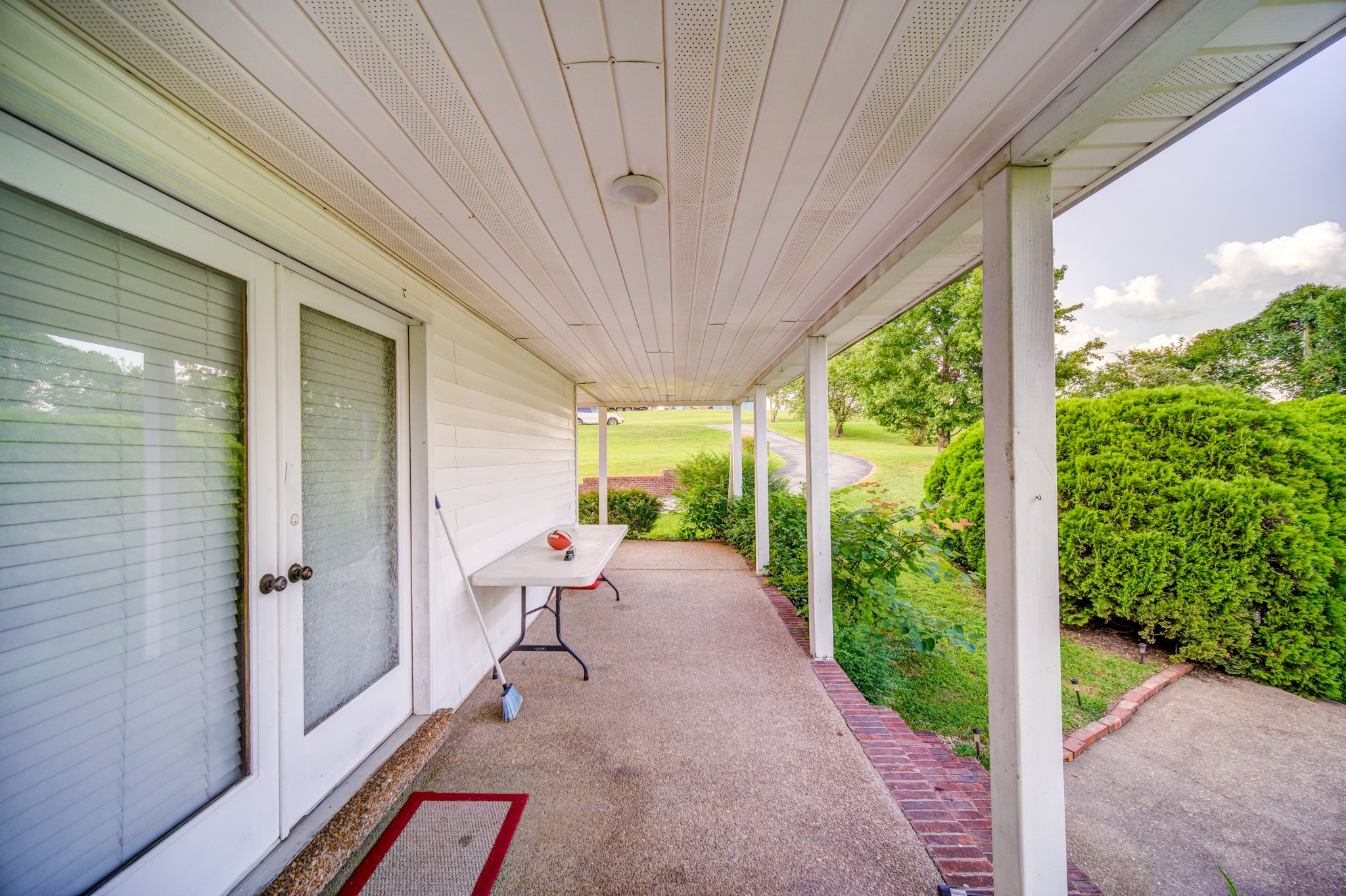 3545 Kelton Jackson Road Springfield, TN 37172 - Photo 5 of 47 a porch with a bench in front of a house