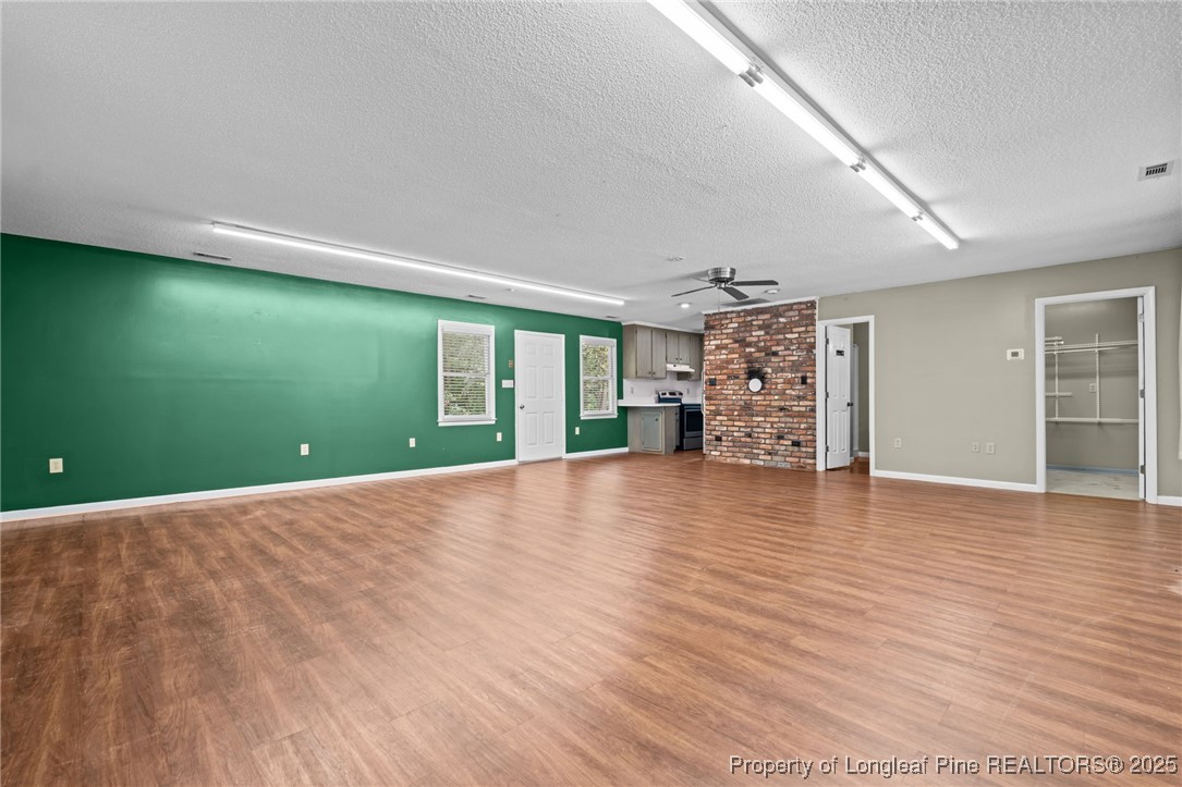 610 Maynard Lake Road Erwin, NC 28339 - Photo 34 of 49 a view of empty room with wooden floor