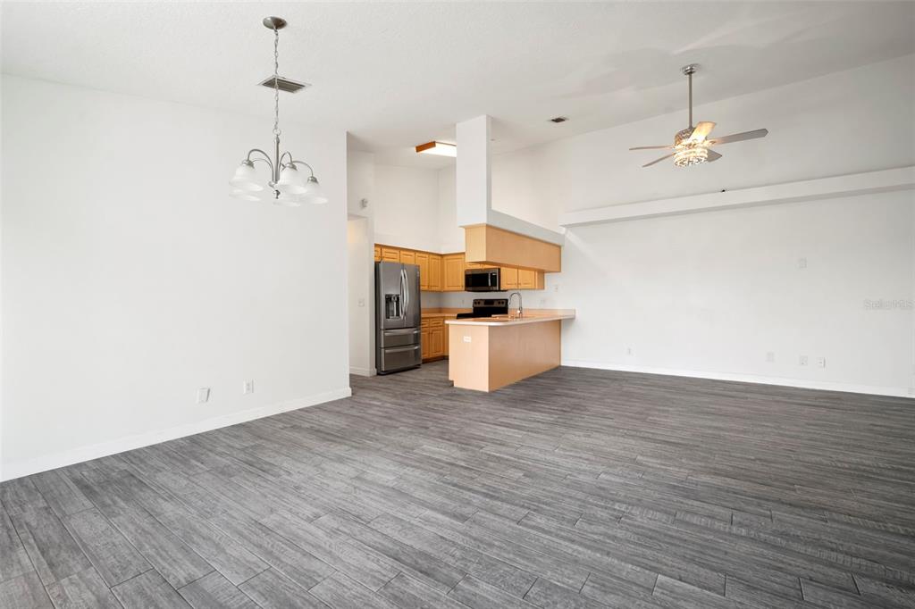 1013 Apollo Beach Boulevard, Unit 203 Apollo Beach, FL 33572 - Photo 18 of 26 a view of a kitchen with a sink wooden floor and a ceiling fan