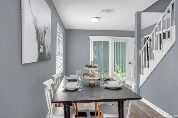 a view of a dining area with furniture and window