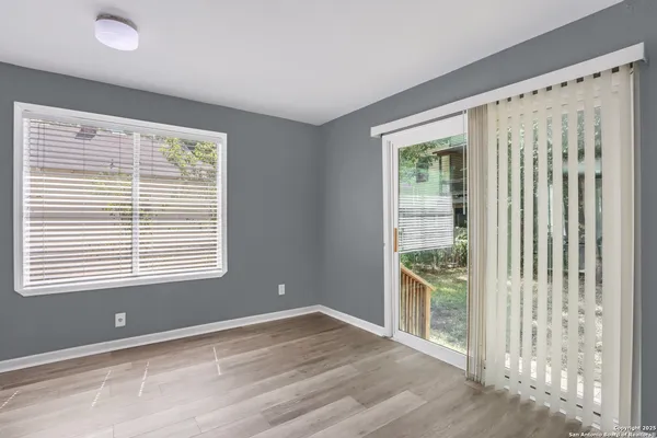 a view of an empty room with a window